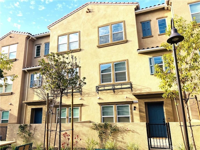 view of front of house featuring stucco siding