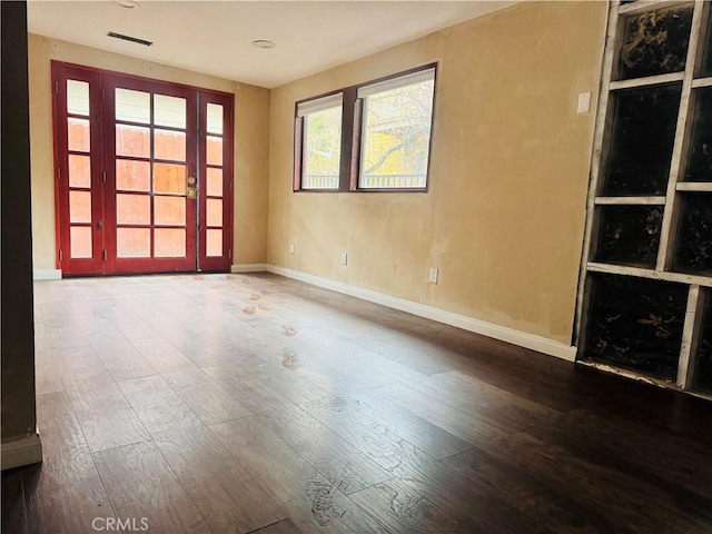 spare room featuring hardwood / wood-style floors