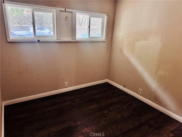 spare room featuring hardwood / wood-style flooring