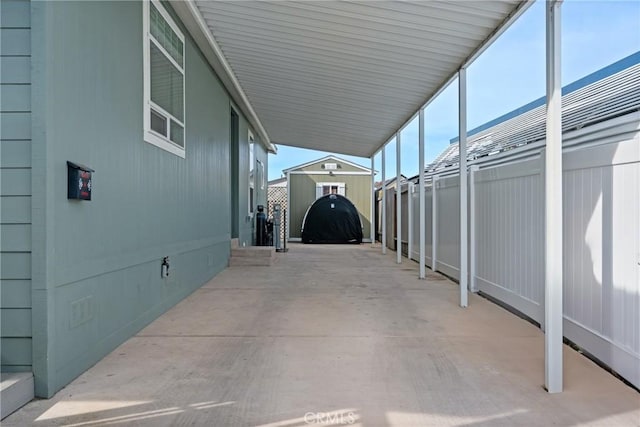 view of parking / parking lot with a carport