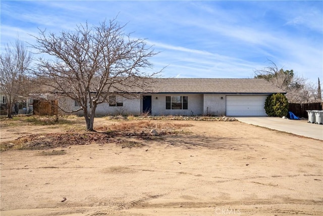 ranch-style home featuring a garage