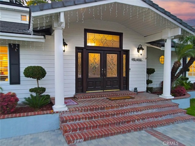 exterior entry at dusk with a porch