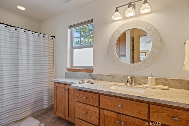 full bathroom featuring vanity and tile patterned floors