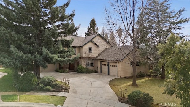 view of front facade featuring an attached garage, driveway, a shingled roof, and a front yard