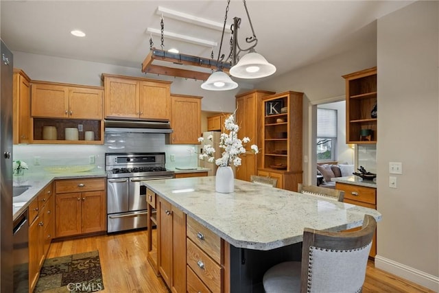 kitchen featuring stainless steel appliances, a kitchen island, a breakfast bar area, and open shelves