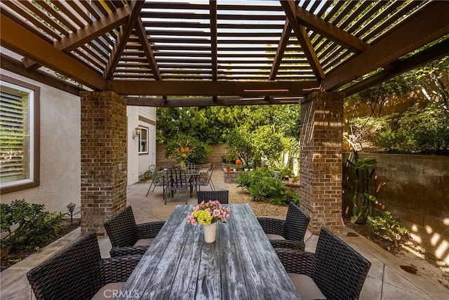 view of patio / terrace featuring outdoor dining space, a fenced backyard, and a pergola