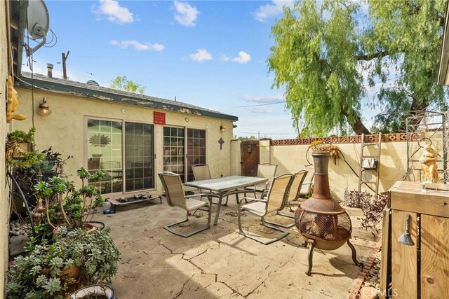 12626 Cometa Ave, San Fernando, CA 91340 - view of patio / terrace featuring a fire pit and outdoor dining area