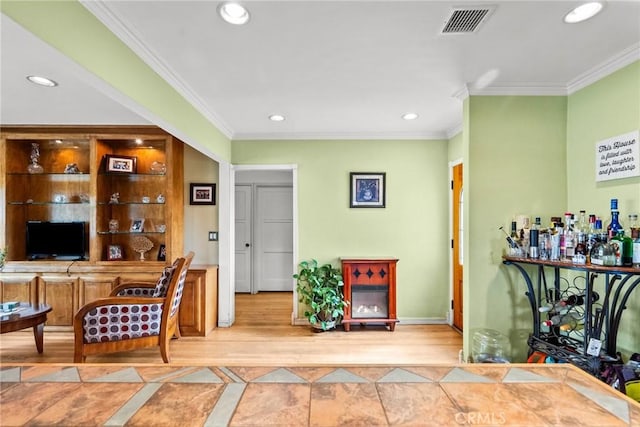 office area featuring baseboards, visible vents, ornamental molding, and recessed lighting