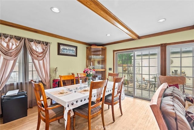 dining room featuring recessed lighting, crown molding, beamed ceiling, and light wood finished floors