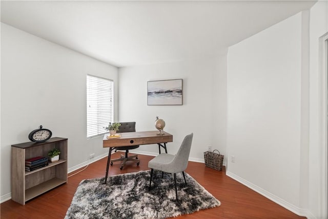 home office featuring baseboards and wood finished floors