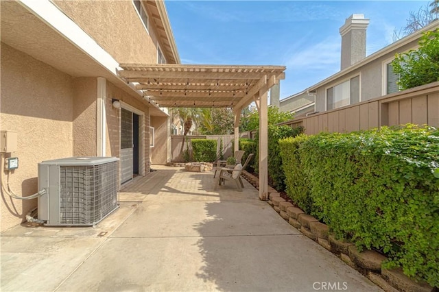 view of patio / terrace featuring cooling unit, a pergola, and a fenced backyard