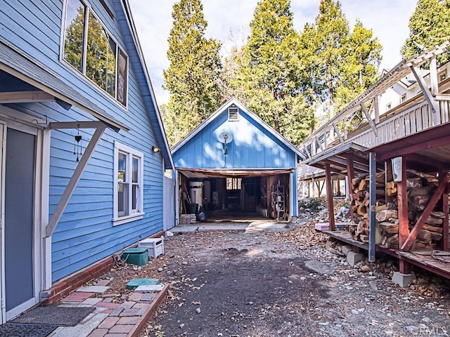 exterior space with an outbuilding and a garage