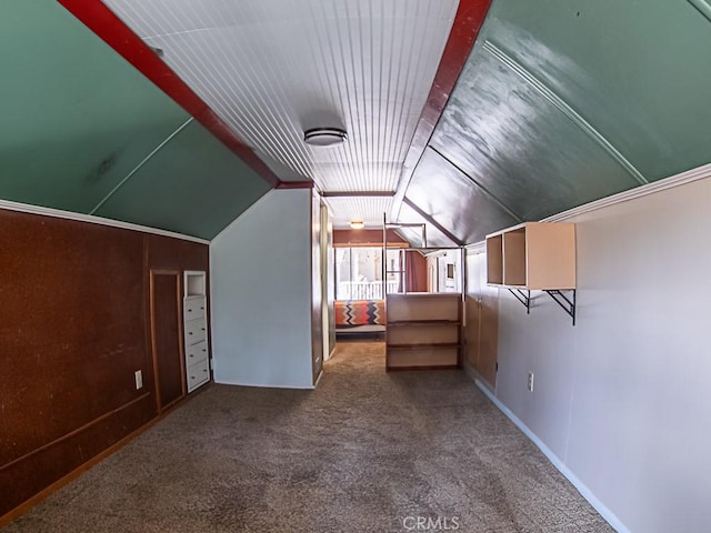 additional living space with vaulted ceiling and carpet