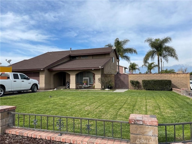 1041 E Riverside Dr, Ontario, CA 91761 - ranch-style house with a garage, a front lawn, fence, and a gate