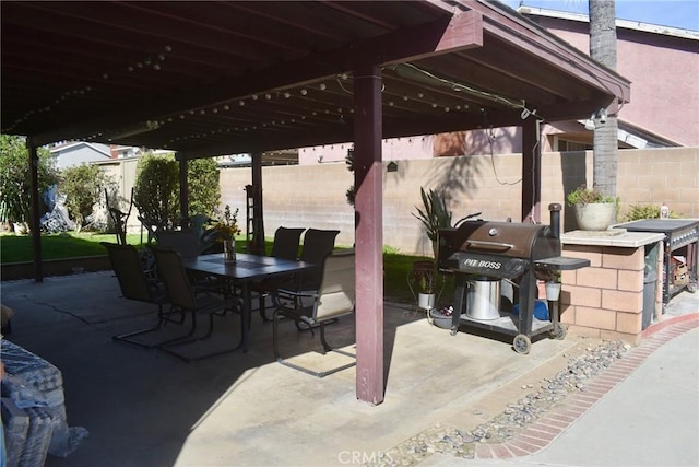 1041 E Riverside Dr, Ontario, CA 91761 - view of patio / terrace with outdoor dining space, fence, outdoor dry bar, and area for grilling