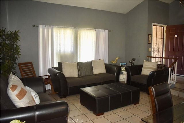 1041 E Riverside Dr, Ontario, CA 91761 - living area featuring light tile patterned floors and vaulted ceiling