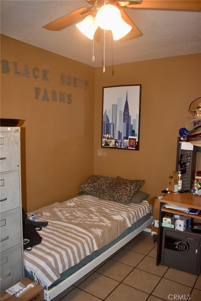 1041 E Riverside Dr, Ontario, CA 91761 - tiled bedroom with a ceiling fan