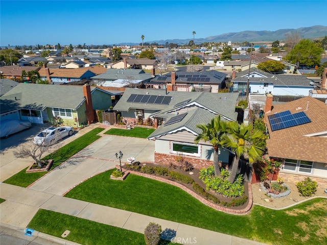 birds eye view of property featuring a mountain view and a residential view