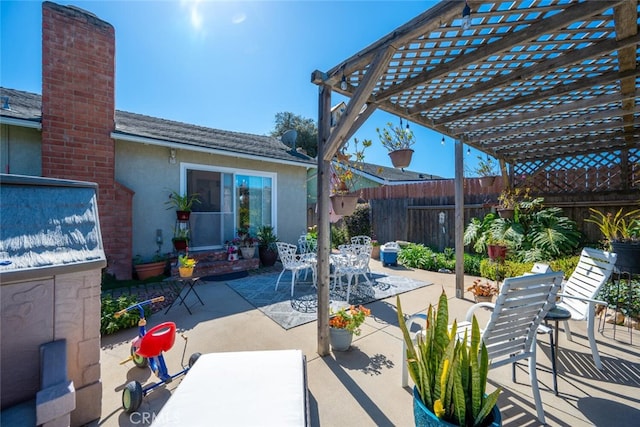 view of patio with fence and a pergola