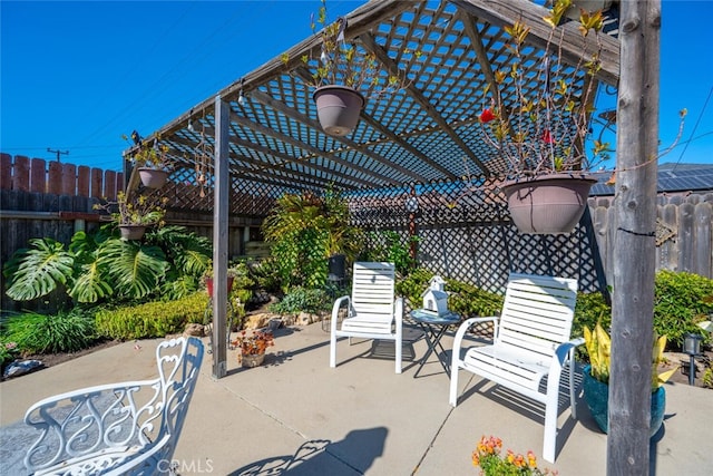 view of patio / terrace featuring fence and a pergola