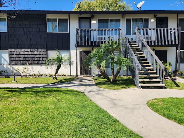 view of property featuring stairs