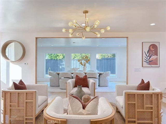 dining room featuring a notable chandelier, plenty of natural light, and hardwood / wood-style floors