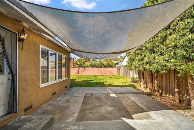 view of patio featuring a fenced backyard and visible vents