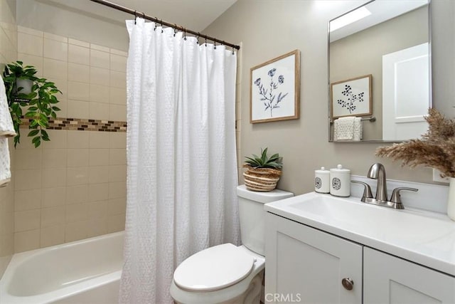 bathroom featuring shower / bath combo, vanity, and toilet