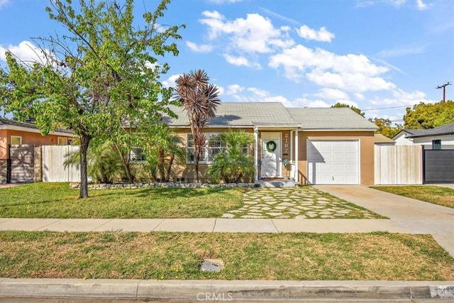 ranch-style home featuring an attached garage, fence, a front lawn, and concrete driveway