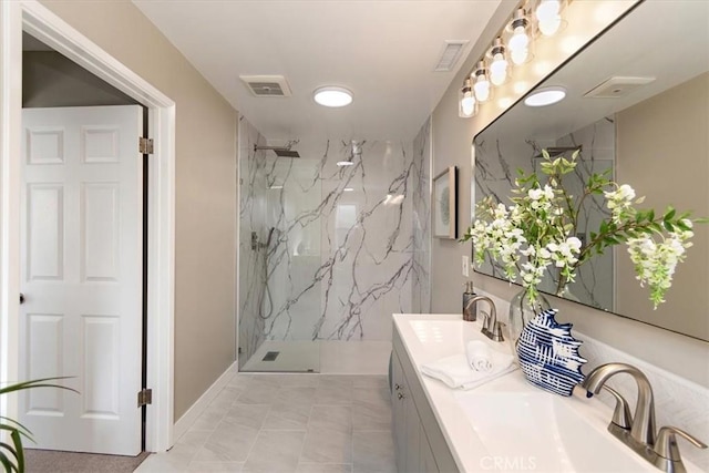 full bath with visible vents, a sink, a marble finish shower, and double vanity