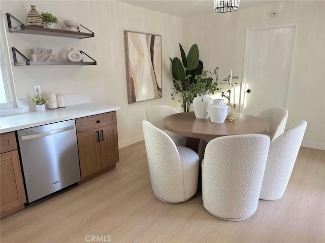 dining space with light wood-type flooring