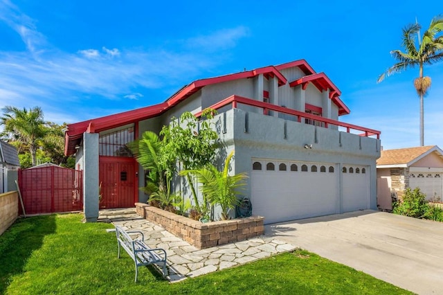 view of front of home with a front yard and a balcony