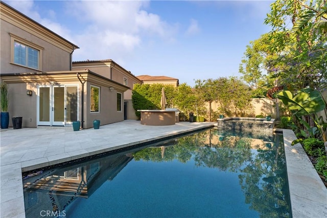 view of swimming pool featuring a fenced in pool and a patio