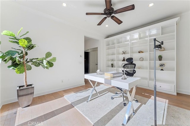 office space with crown molding, baseboards, wood finished floors, and recessed lighting