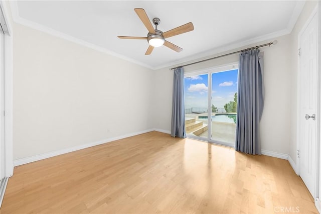 empty room featuring crown molding, ceiling fan, and light hardwood / wood-style flooring