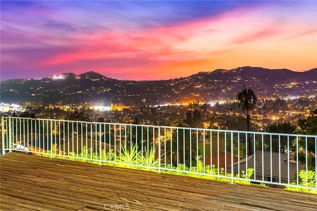 deck at dusk with a mountain view