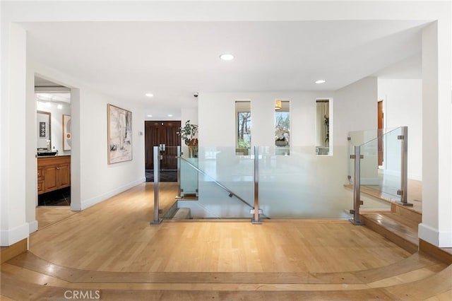 exercise area featuring light hardwood / wood-style flooring