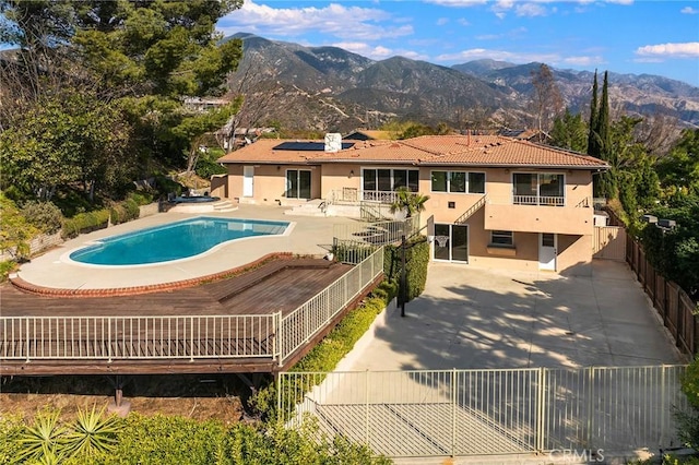 view of pool featuring a patio and a mountain view