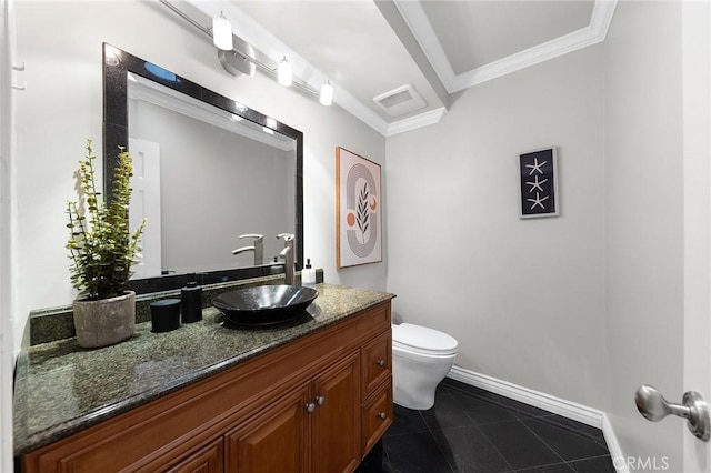 bathroom with vanity, crown molding, toilet, and tile patterned floors