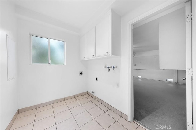 laundry room featuring light tile patterned flooring, washer hookup, cabinets, and electric dryer hookup