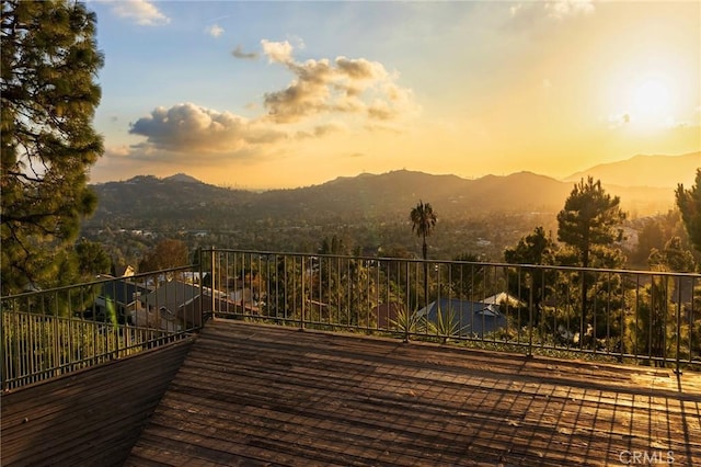 deck at dusk with a mountain view