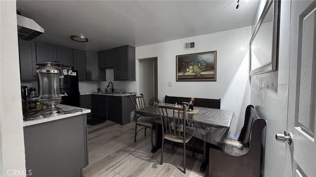 10813 State St, Lynwood, CA 90262 - dining space featuring light wood-type flooring