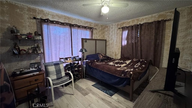 10813 State St, Lynwood, CA 90262 - bedroom with wood finished floors, a textured ceiling, and ceiling fan