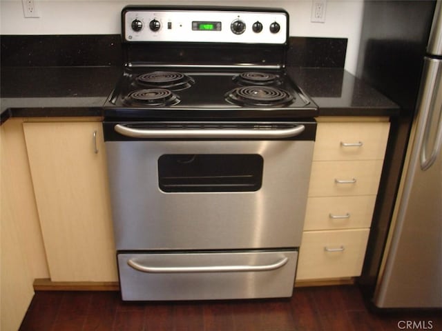 kitchen with dark wood-style flooring and stainless steel appliances