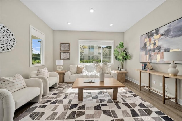 living room with recessed lighting, wood finished floors, and baseboards