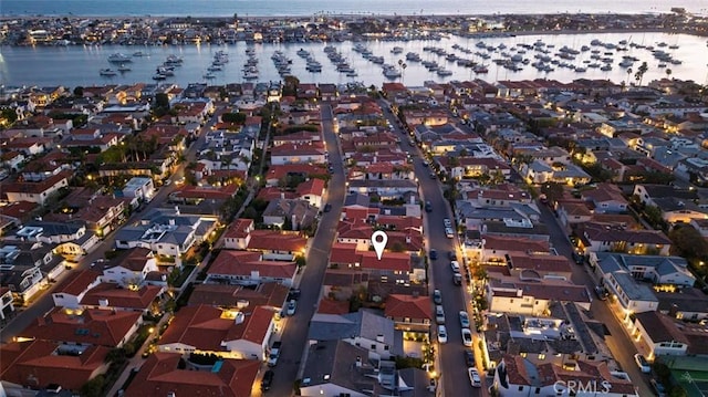 aerial view featuring a water view and a residential view