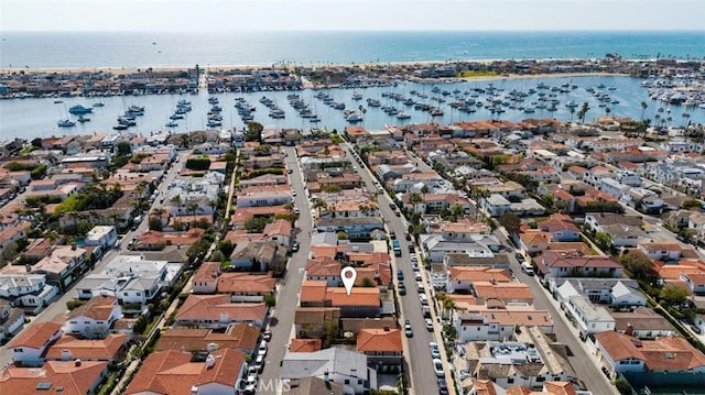 bird's eye view with a residential view and a water view