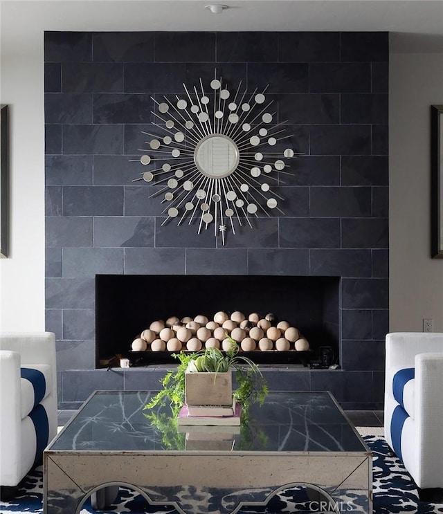 details with a tiled fireplace