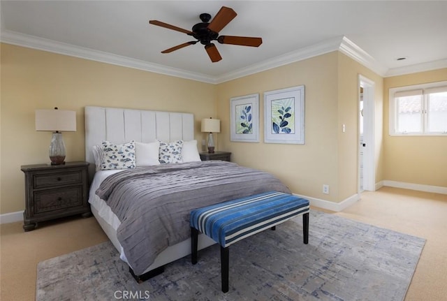 bedroom with crown molding, baseboards, ceiling fan, and carpet