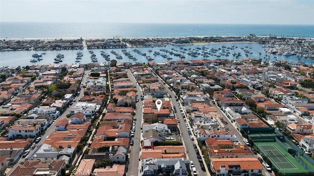 bird's eye view featuring a water view and a residential view